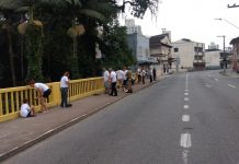 Ponte na rua São Paulo é pintada em ação do Maio Amarelo